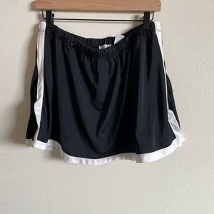 black swim skort with white trim
